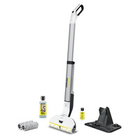 Kärcher floor cleaner with detergent bottles, cleaning rollers, and a black stand on a white background.
