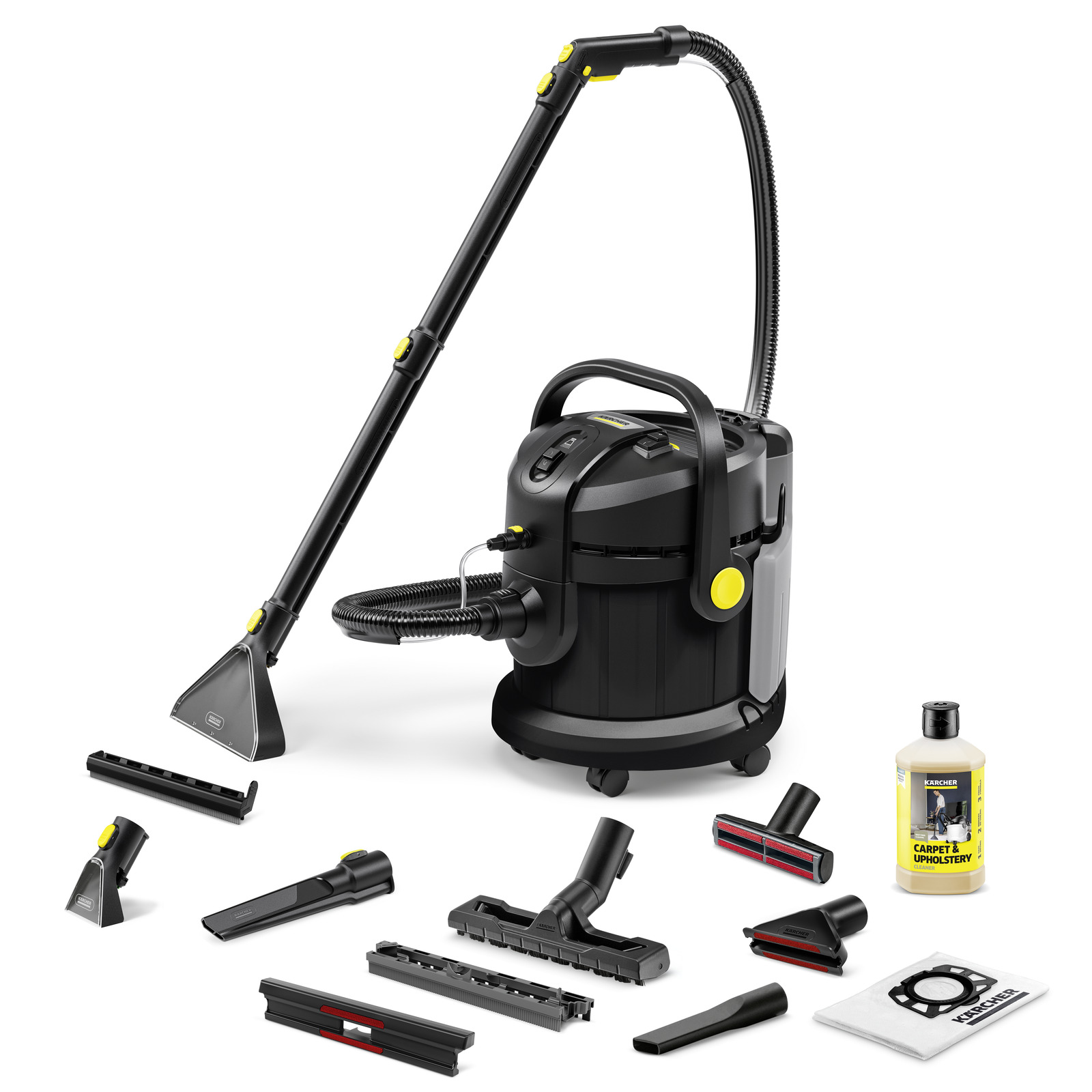 Kärcher carpet cleaner with various attachments, cleaning solution bottle, and vacuum bag on a white background.