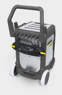 Kärcher professional cleaning machine with a handle, cable wrapped around, and white wheels on a grey and silver body.