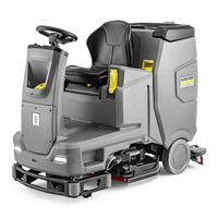 Kärcher ride-on floor scrubber with a black seat, steering wheel, and grey body.