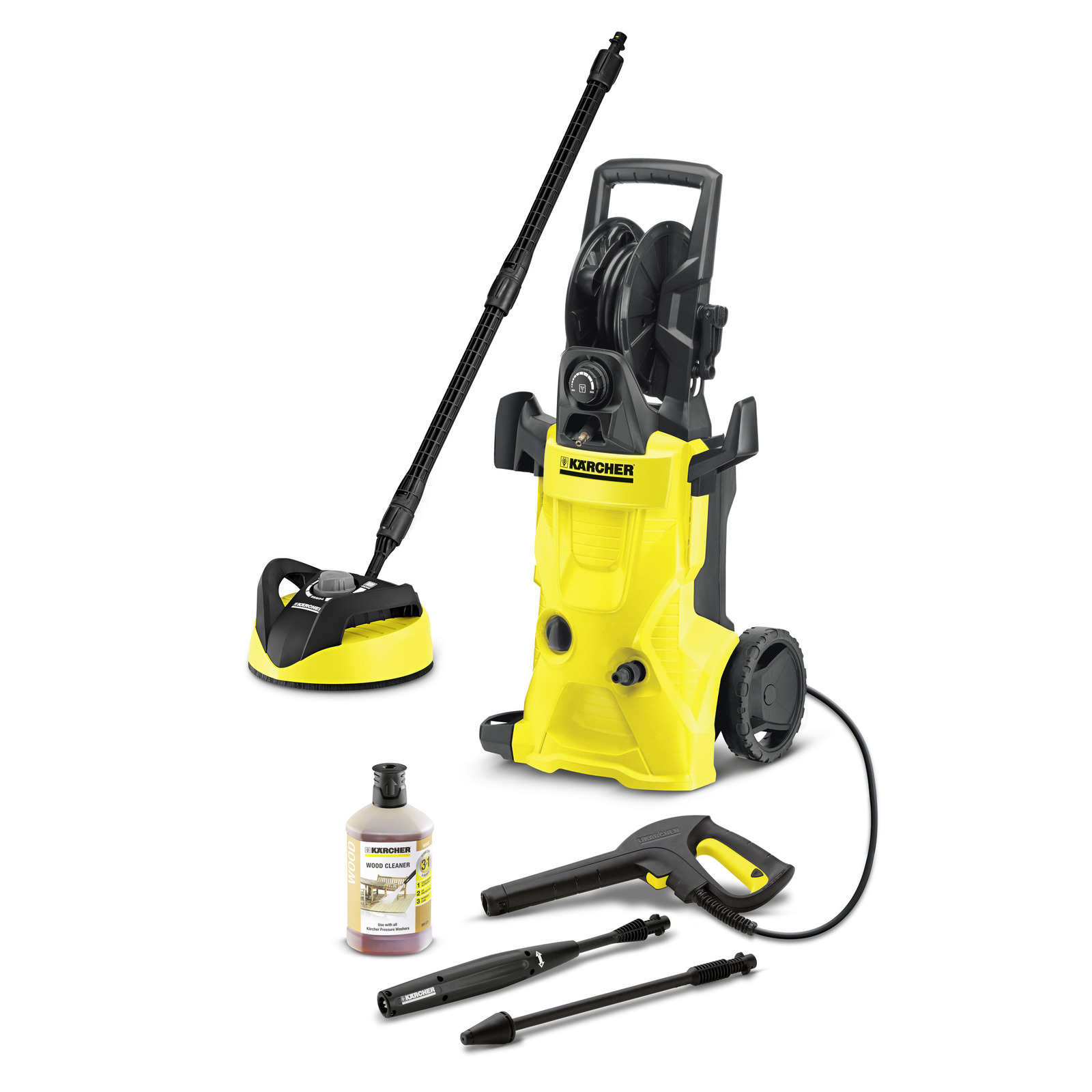 Kärcher high-pressure cleaner with accessories: surface cleaner, wood cleaner bottle, spray gun, and extension wands.