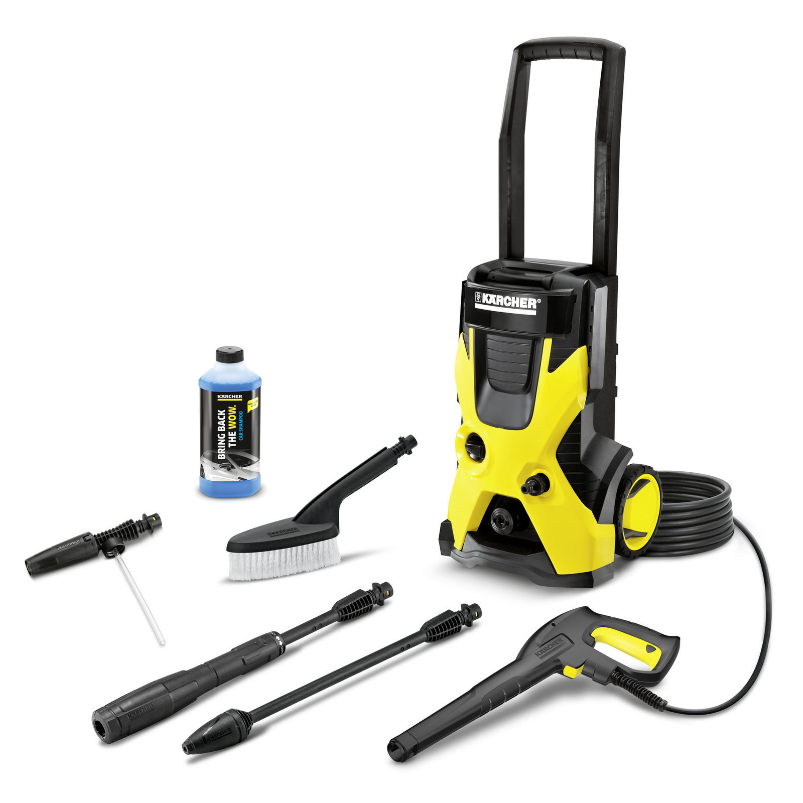 Kärcher high-pressure cleaner with accessories including detergent bottle, brush, spray gun, and extension wands on white background. Kärcher high-pressure cleaner with accessories including detergent bottle, brush, spray gun, and extension wands on white background.