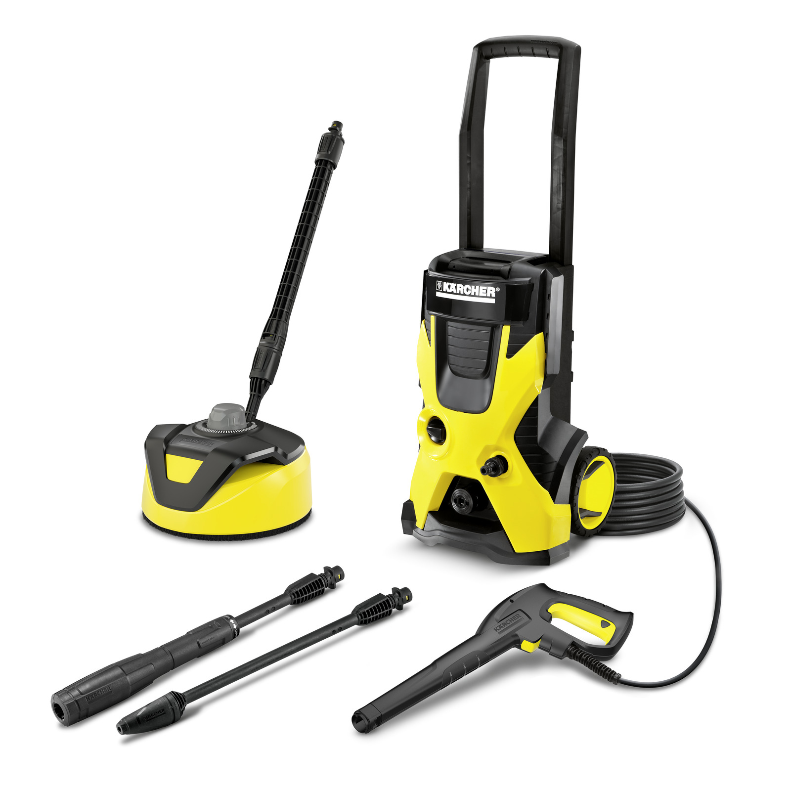 Kärcher high-pressure cleaner with accessories including a surface cleaner, two spray lances, and a trigger gun, all in yellow and black.