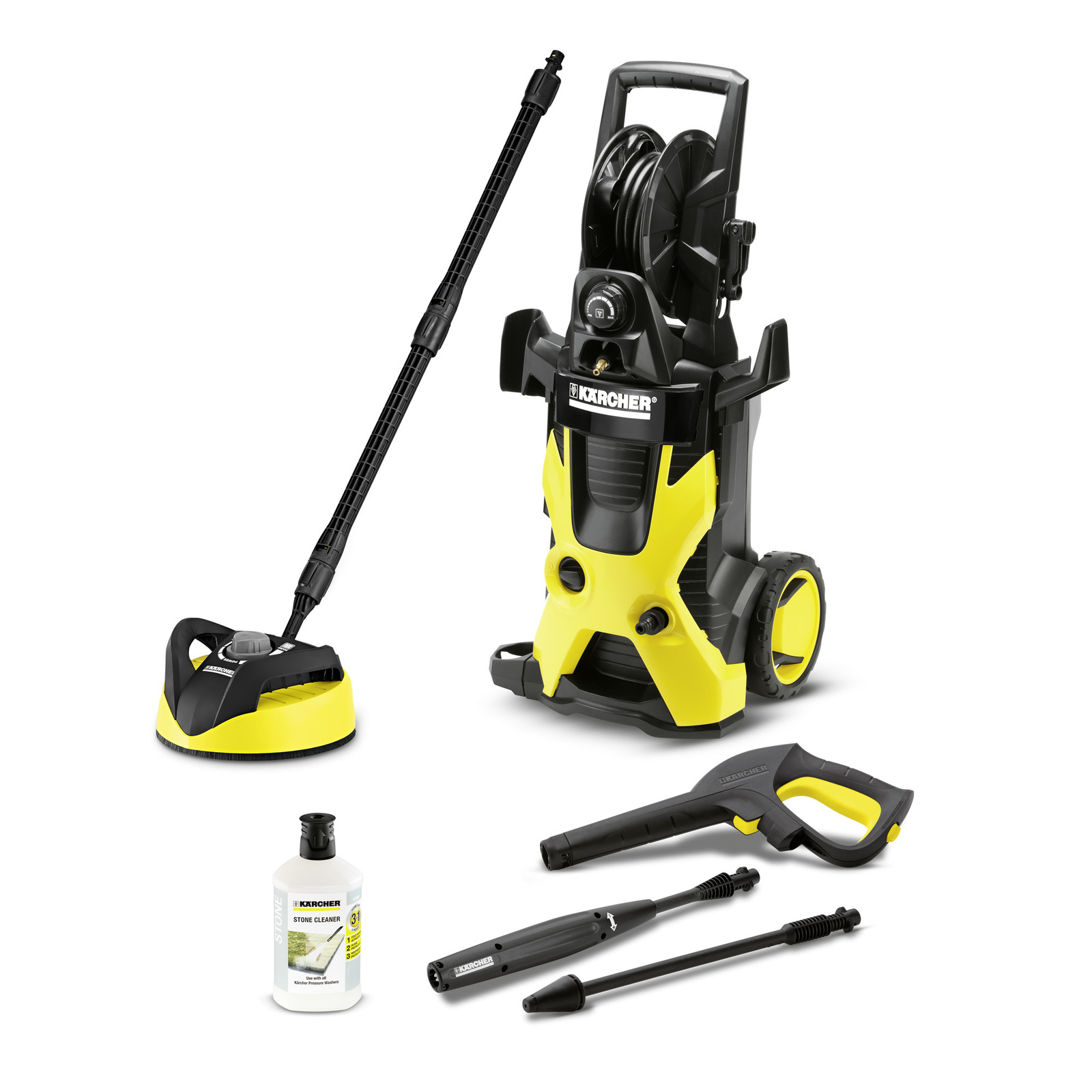 Kärcher high-pressure cleaner with accessories including a surface cleaner, stone cleaner bottle, spray gun, and two lance attachments.