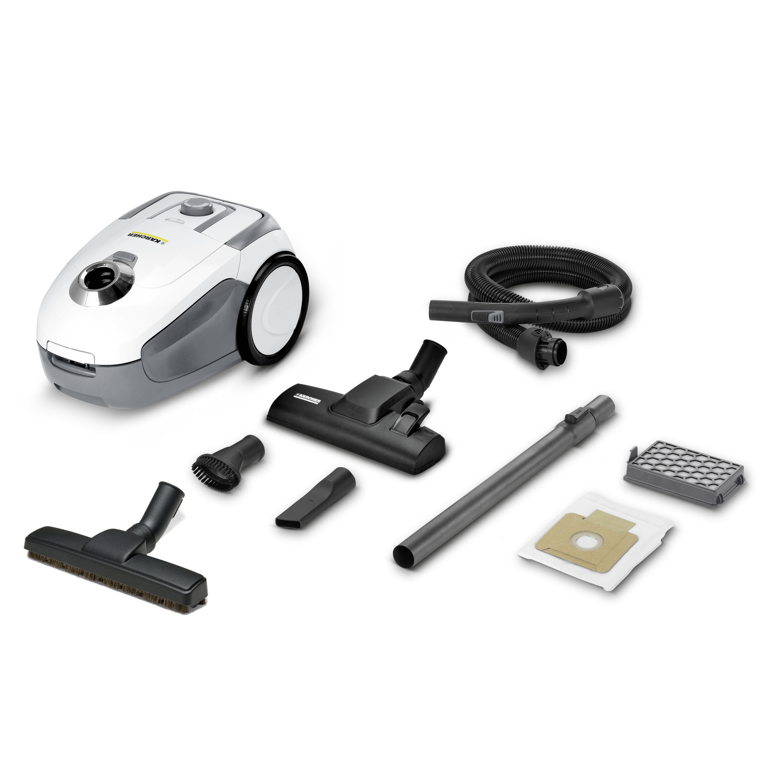 Kärcher vacuum cleaner with attachments, including hose, brush, nozzle, extension tube, filter, and dust bag on white background.