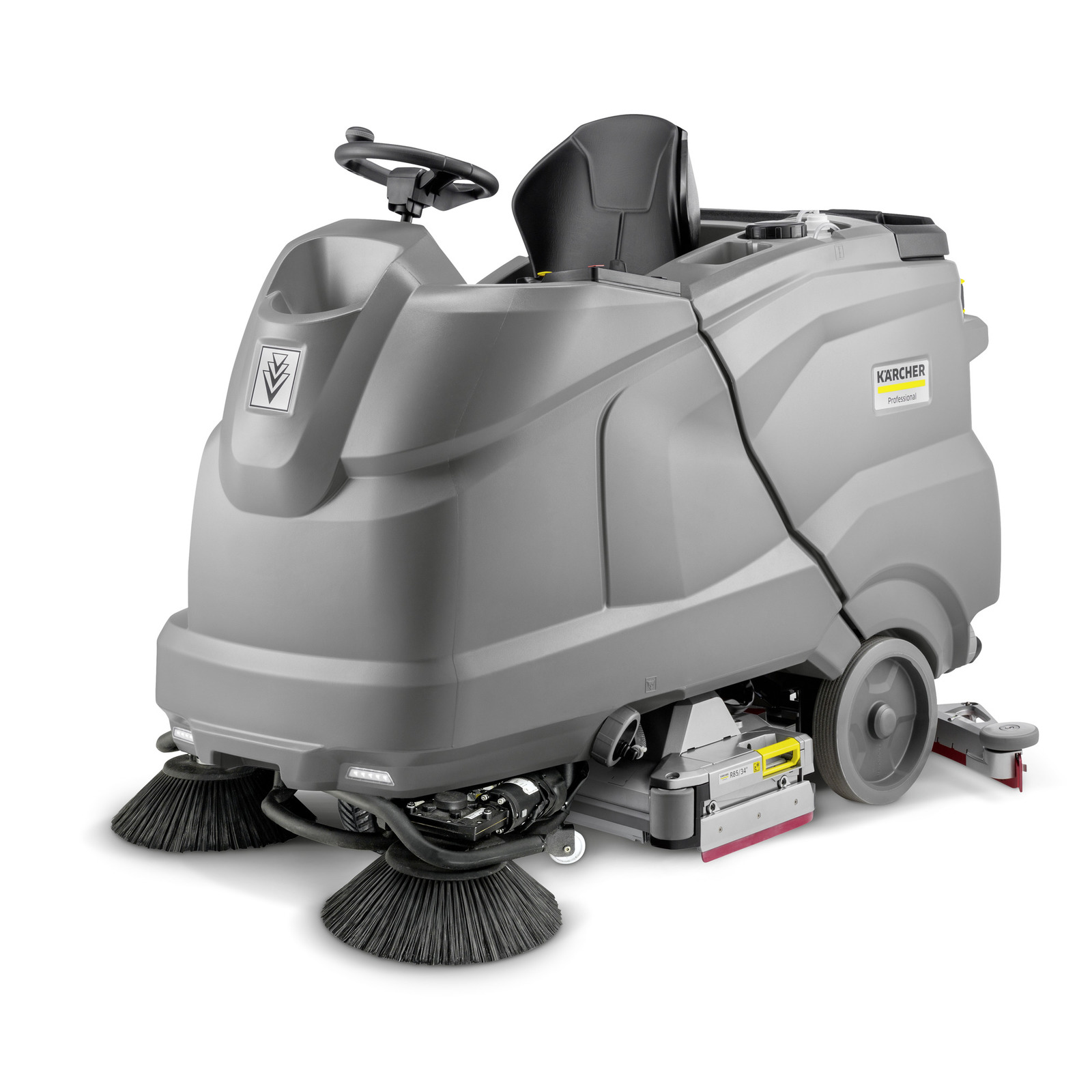Kärcher ride-on floor scrubber with steering wheel, grey body, and visible brushes at the front.