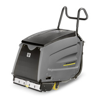 Grey Kärcher floor scrubber with black top and yellow accents, featuring dual handles and visible brush mechanism at the front.