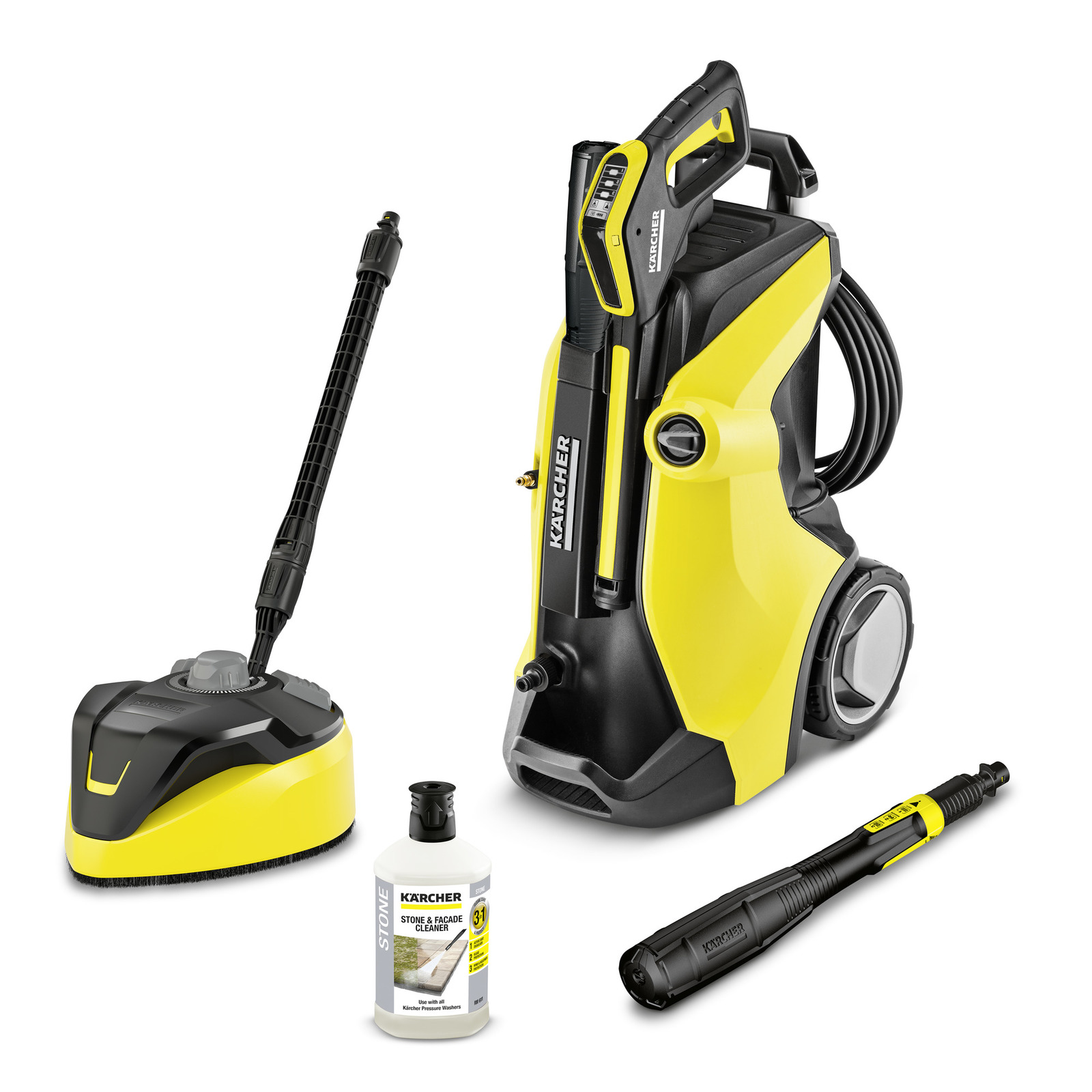 Kärcher high-pressure cleaner with accessories: surface cleaner, stone and facade cleaner bottle, and spray lance.