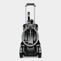 Kärcher high-pressure cleaner with hose wrapped around the front, featuring wheels and a handle for mobility.