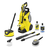 Kärcher K4 high-pressure cleaner with accessories, including a surface cleaner, two detergent bottles, and various nozzles.
