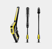Kärcher high-pressure cleaner handle and two black spray lances with yellow accents on a grey background.