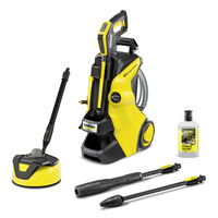 Kärcher K5 pressure washer with accessories: surface cleaner, two spray lances, and stone & facade detergent bottle.