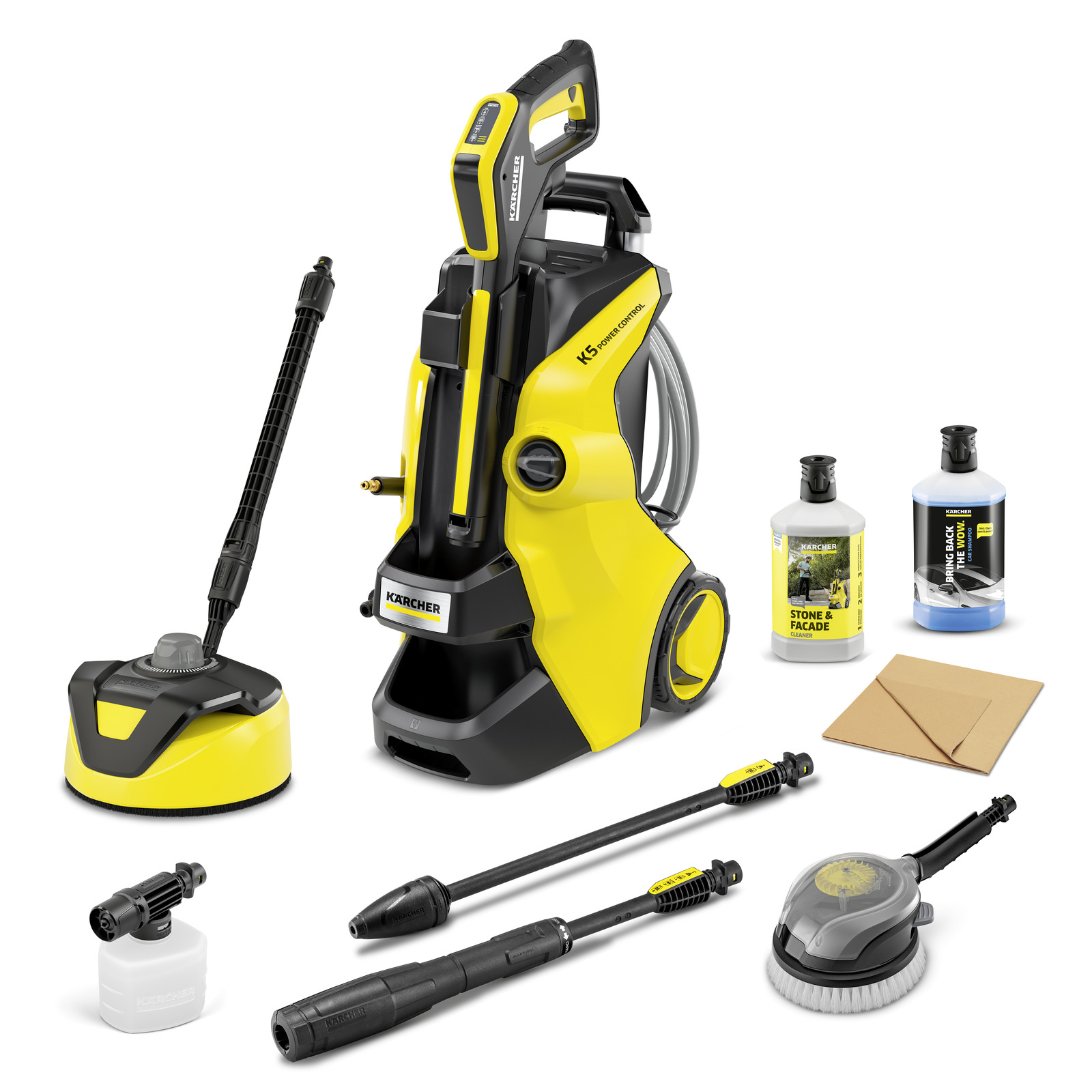 Kärcher high-pressure cleaner with accessories, including detergent bottles, a brush, and various nozzles, set against a white background.