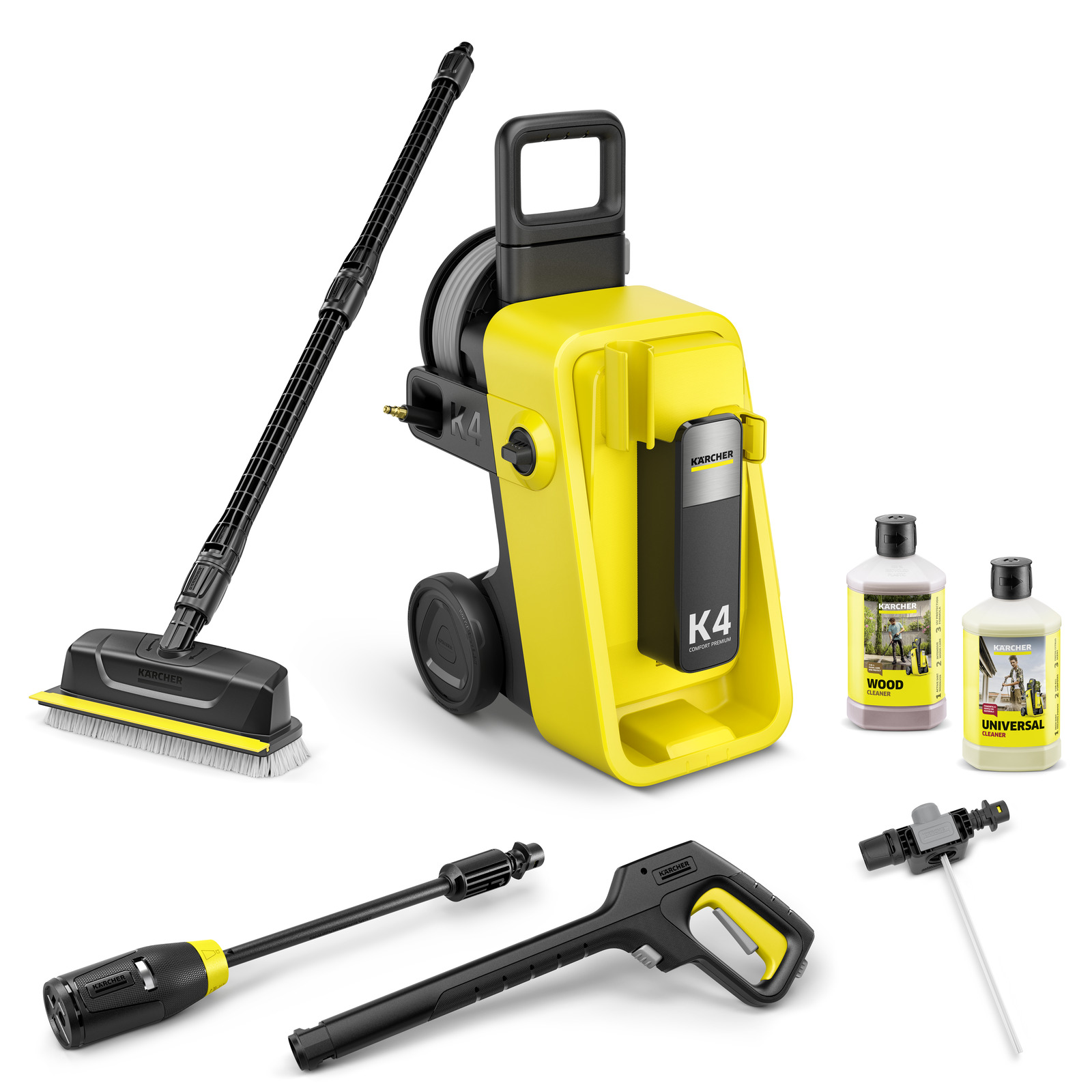 Aspirator Kärcher K4 cu accesorii: lance, perie, pistol de presiune și două sticle de detergent.