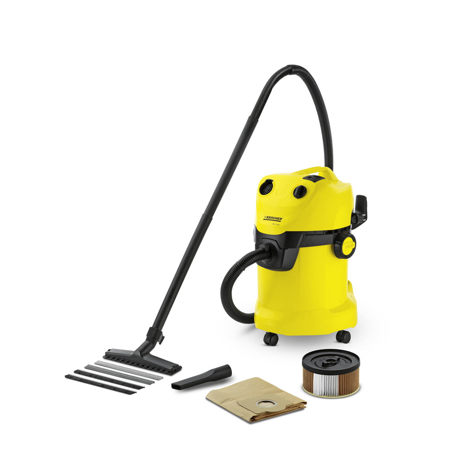 Yellow Kärcher wet and dry vacuum cleaner with hose, nozzle, filter, and dust bag on white background.