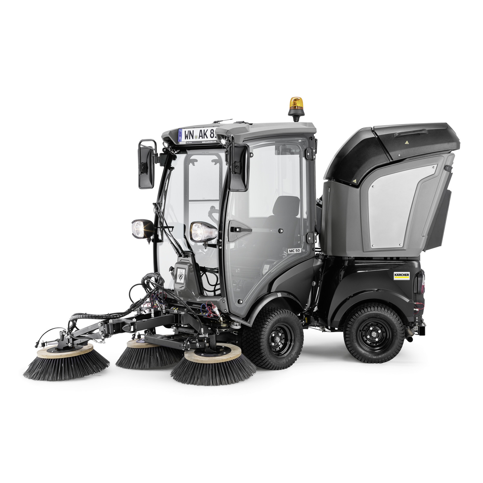 Kärcher MC 50 street sweeper with dual rotating brushes, enclosed cab, and rear waste container, displayed on a white background.