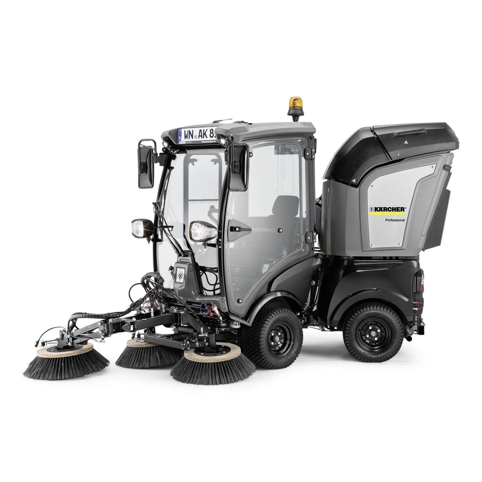 Kärcher street sweeper with dual rotating brushes, enclosed cab, and rear waste container on white background.