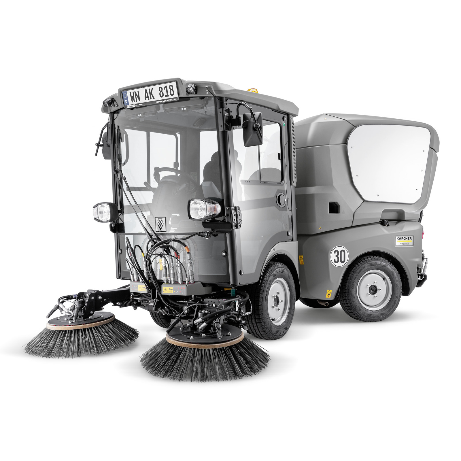 Grey Kärcher street sweeper with dual rotating brushes, enclosed cabin, and visible control panel, parked on a white background. Grey Kärcher street sweeper with dual rotating brushes, enclosed cabin, and visible control panel, parked on a white background.