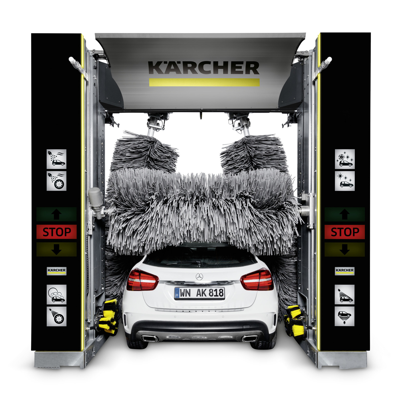 White Mercedes car in a Kärcher car wash machine, surrounded by rotating brushes and stop signs on either side.