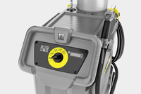 Kärcher industrial vacuum cleaner control panel with yellow dial and icons, grey casing, and attached hose.
