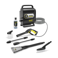 Kärcher Silent Technology high-pressure cleaner with accessories, including spray gun, detergent bottle, extension wands, and brush.