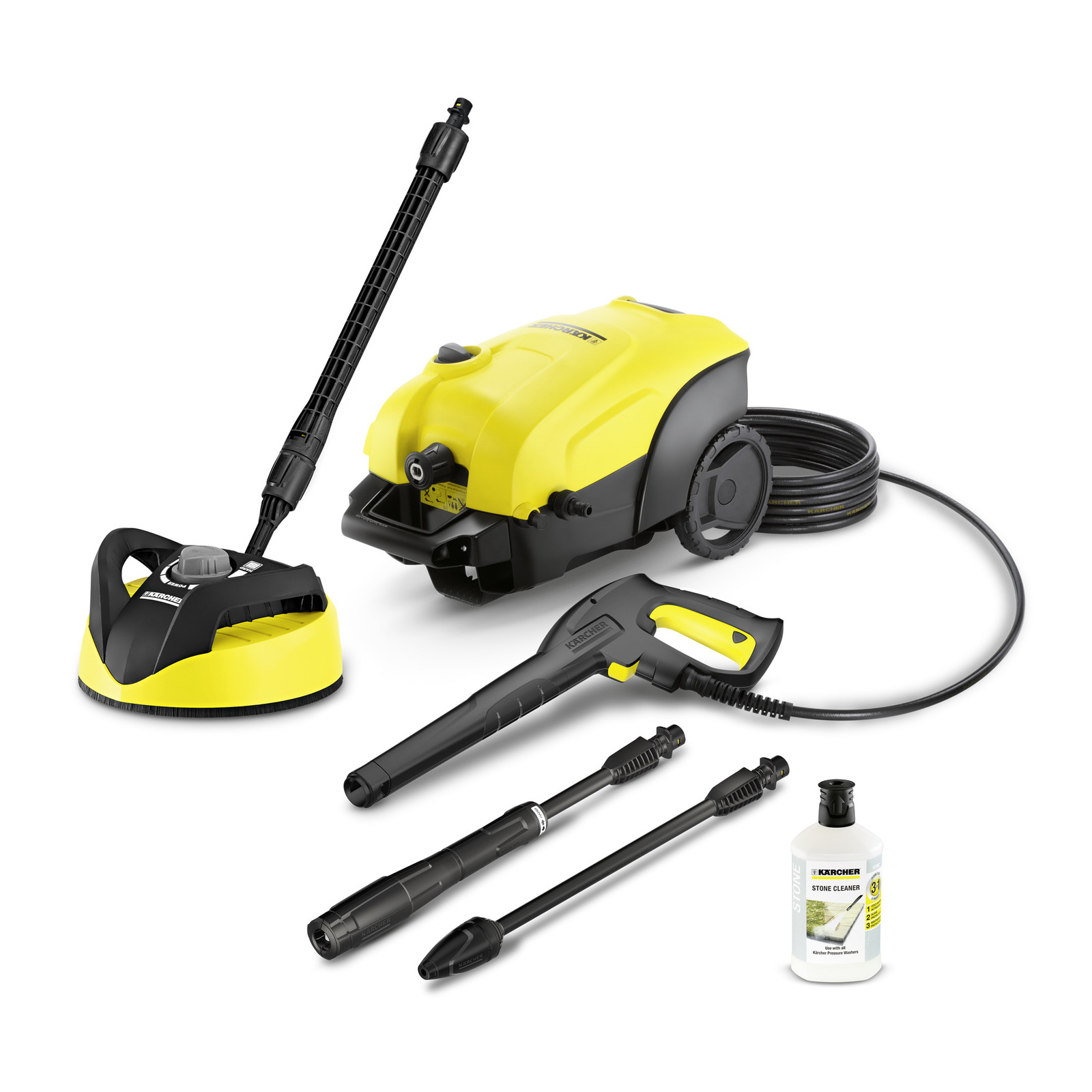 Kärcher high-pressure cleaner with accessories, including a surface cleaner, spray gun, extension wands, and stone cleaner bottle.