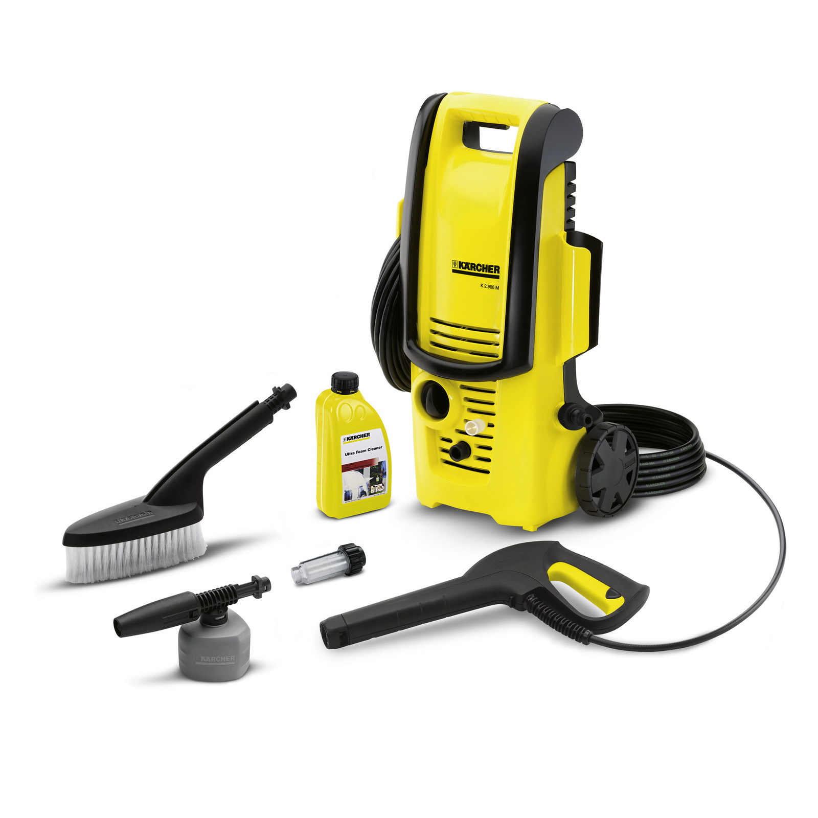 Kärcher high-pressure cleaner with accessories: brush, foam nozzle, detergent bottle, and hose.