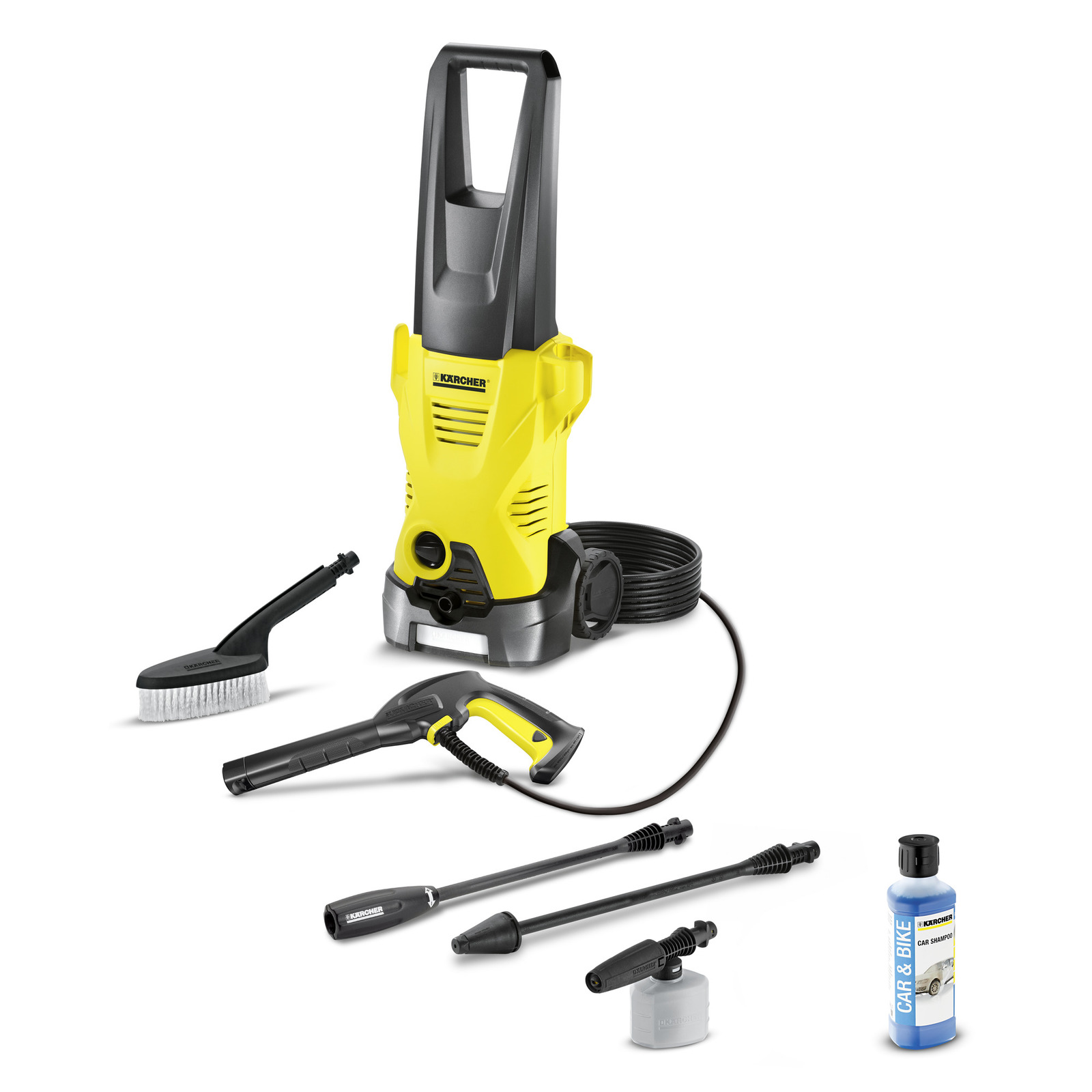 Kärcher high-pressure cleaner with accessories including a brush, spray gun, nozzles, hose, and car shampoo bottle.