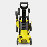 Yellow Kärcher high-pressure cleaner with black handle, wheels, and attached hose, viewed from the front.