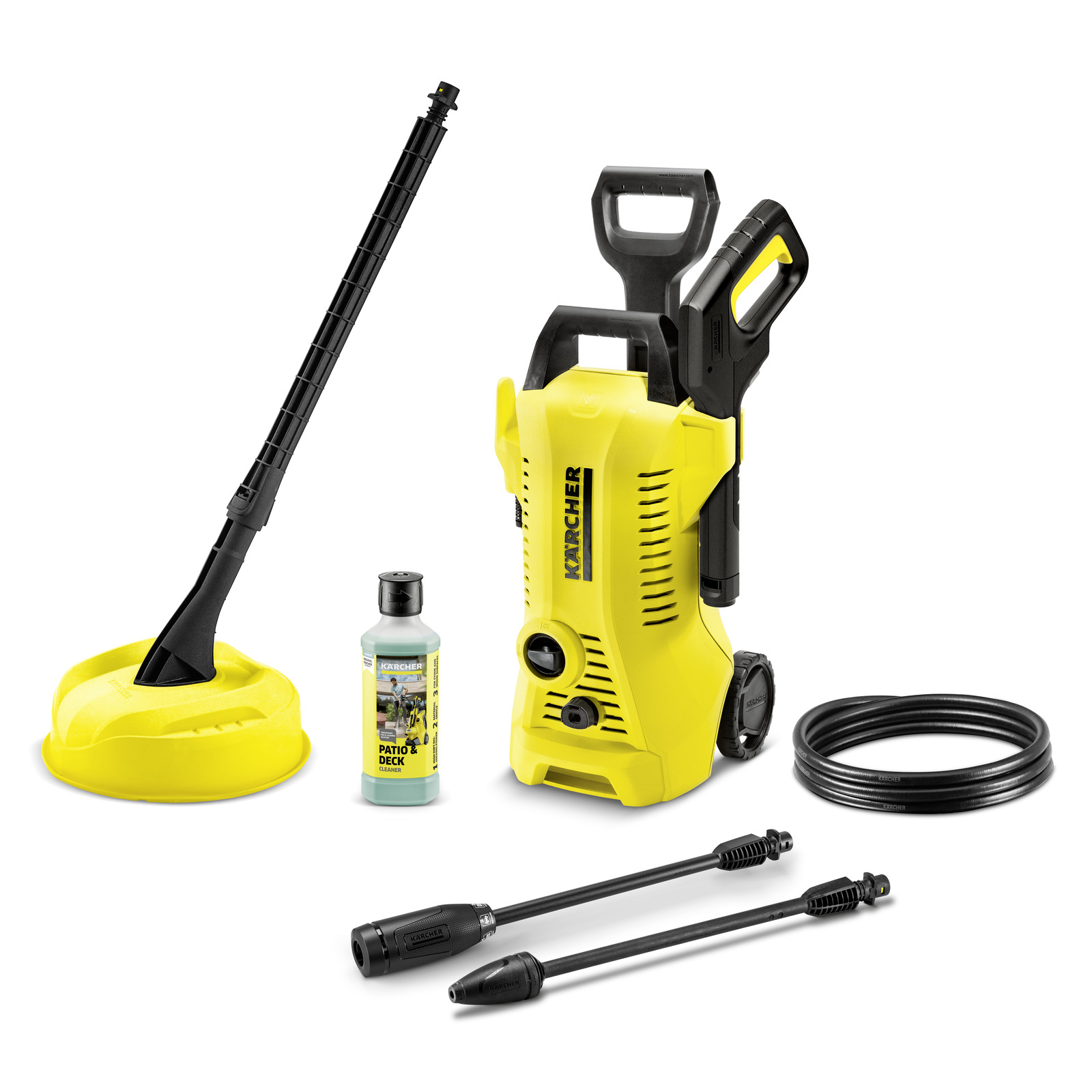 Kärcher high-pressure cleaner set with accessories: surface cleaner, detergent bottle, hose, and two spray lances.
