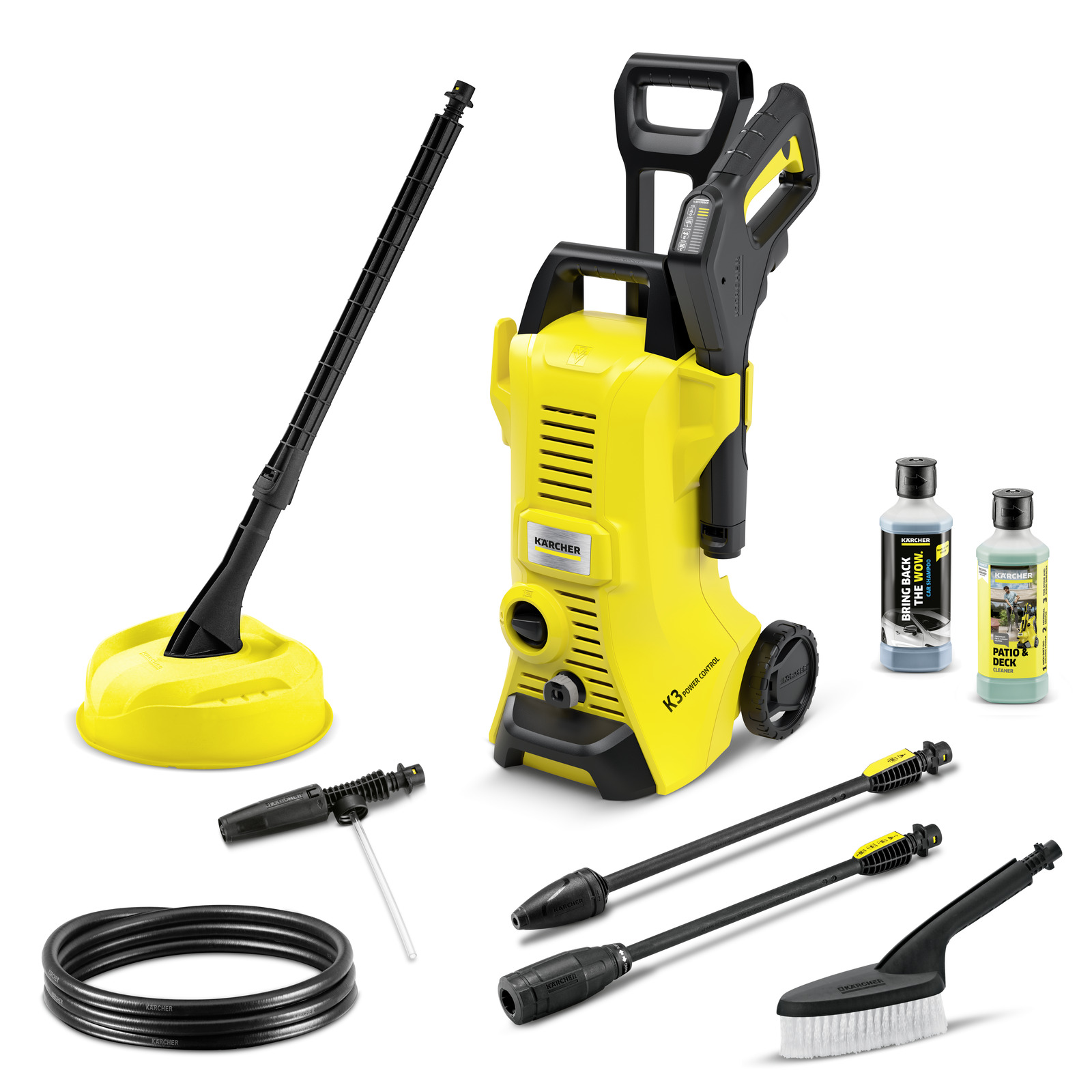 Kärcher K3 high-pressure cleaner set with accessories, including hose, brush, lance, patio cleaner, and detergent bottles.