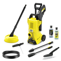 Kärcher K3 high-pressure cleaner set with accessories, including hose, brush, lance, patio cleaner, and detergent bottles.