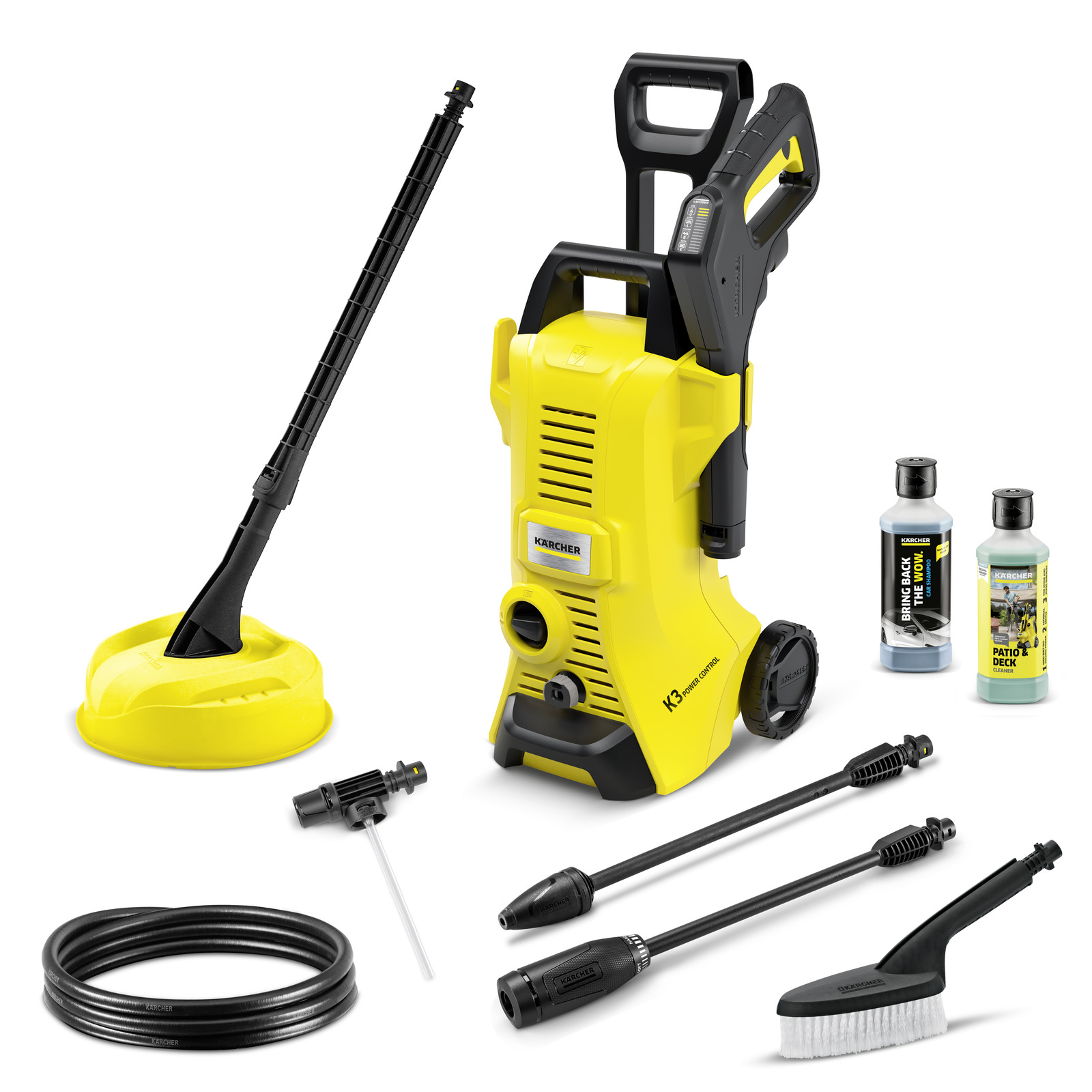 Kärcher K3 high-pressure cleaner set with accessories, including nozzles, hose, brush, surface cleaner, and two detergent bottles. Kärcher K3 high-pressure cleaner set with accessories, including nozzles, hose, brush, surface cleaner, and two detergent bottles.