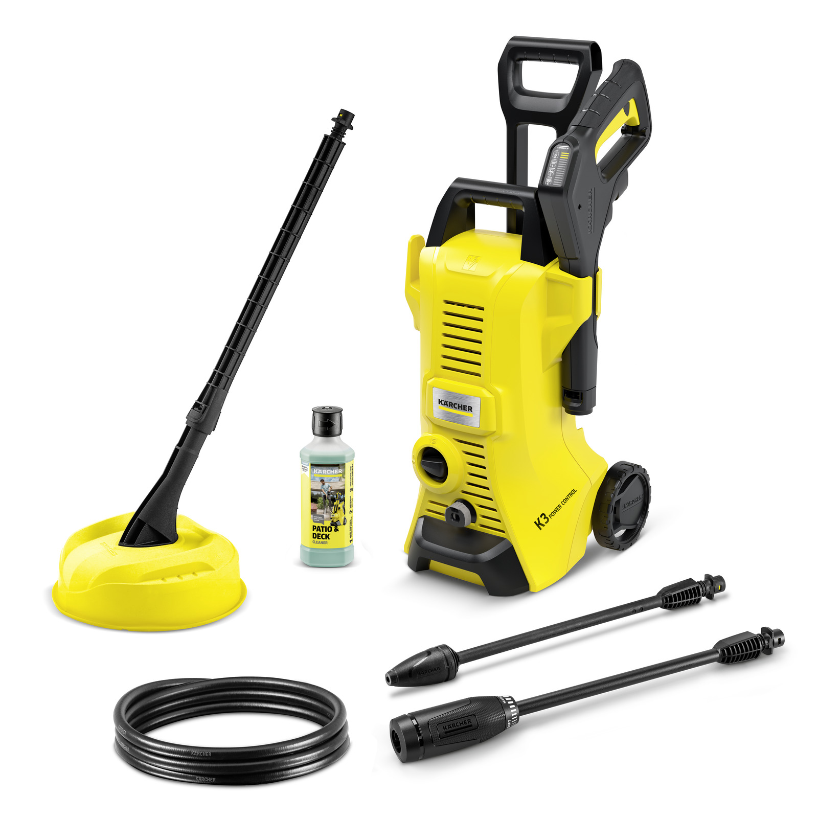 Kärcher K3 high-pressure cleaner with accessories including a yellow surface cleaner, detergent bottle, hose, and two spray lances.