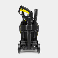 Kärcher high-pressure cleaner with yellow and black handle, mounted on wheels, viewed from the front.