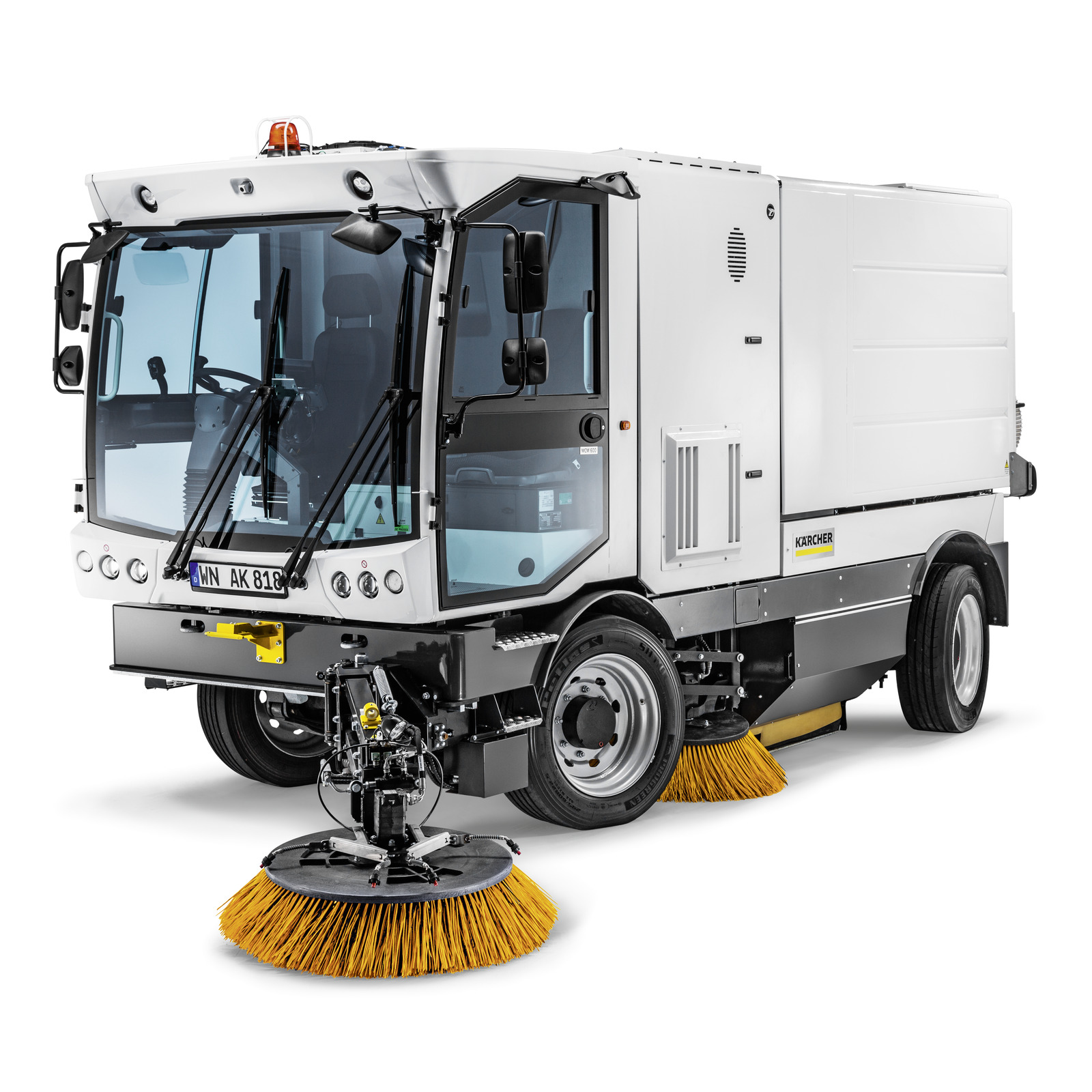 Kärcher street sweeper with large front brush, white body, and clear cab windows, designed for outdoor cleaning tasks.