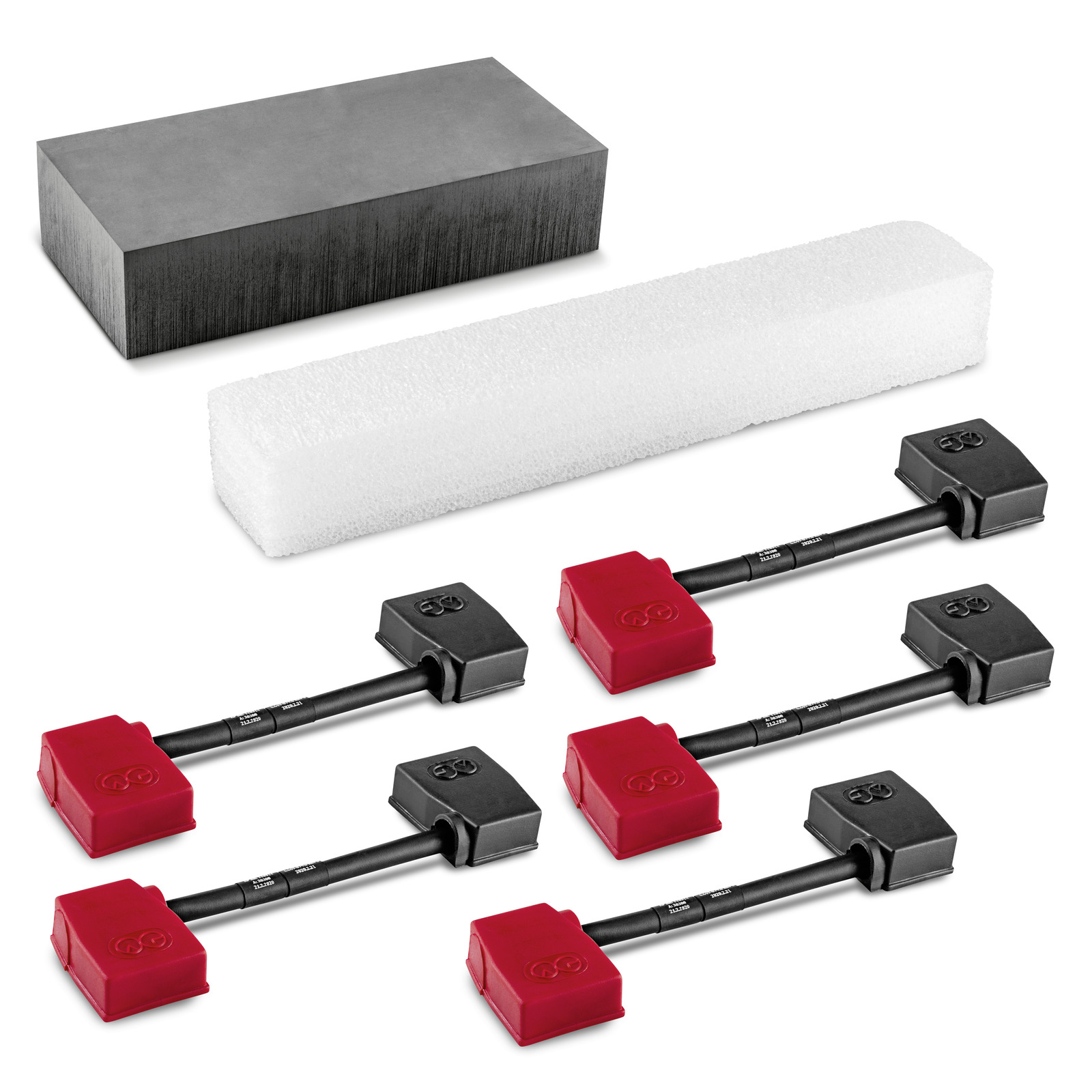Kärcher replacement kit with black and red brushes, a black rectangular block, and a white foam block. Kärcher replacement kit with black and red brushes, a black rectangular block, and a white foam block.