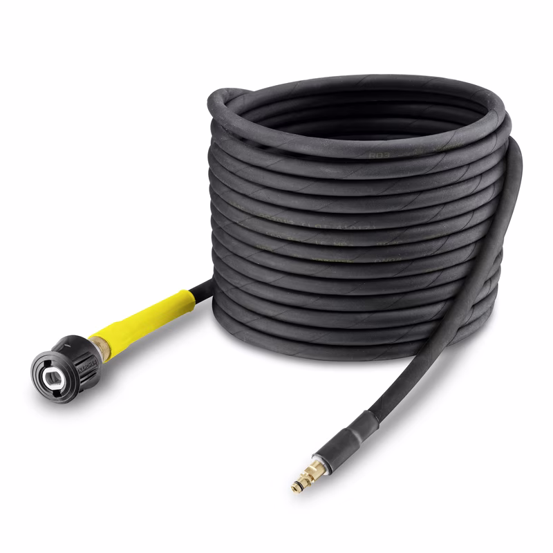 Coiled Kärcher high-pressure hose with yellow connector and brass fitting on a white background.