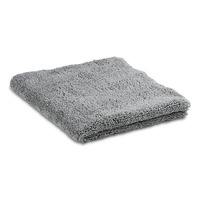 Grey microfibre cloth folded neatly, showcasing its soft and textured surface.