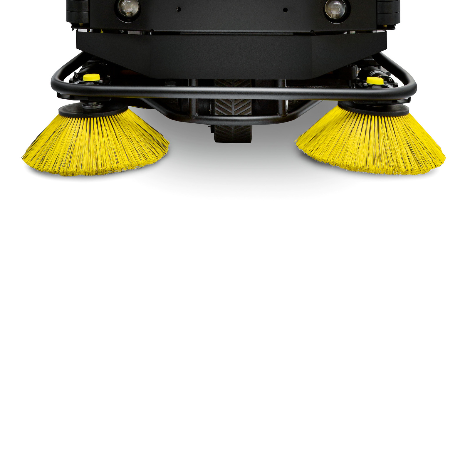 Front view of a Kärcher floor sweeper with two yellow circular brushes on a white background. Front view of a Kärcher floor sweeper with two yellow circular brushes on a white background.