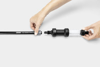 Hands connecting Kärcher Rain System hose to a filter component on a white background.
