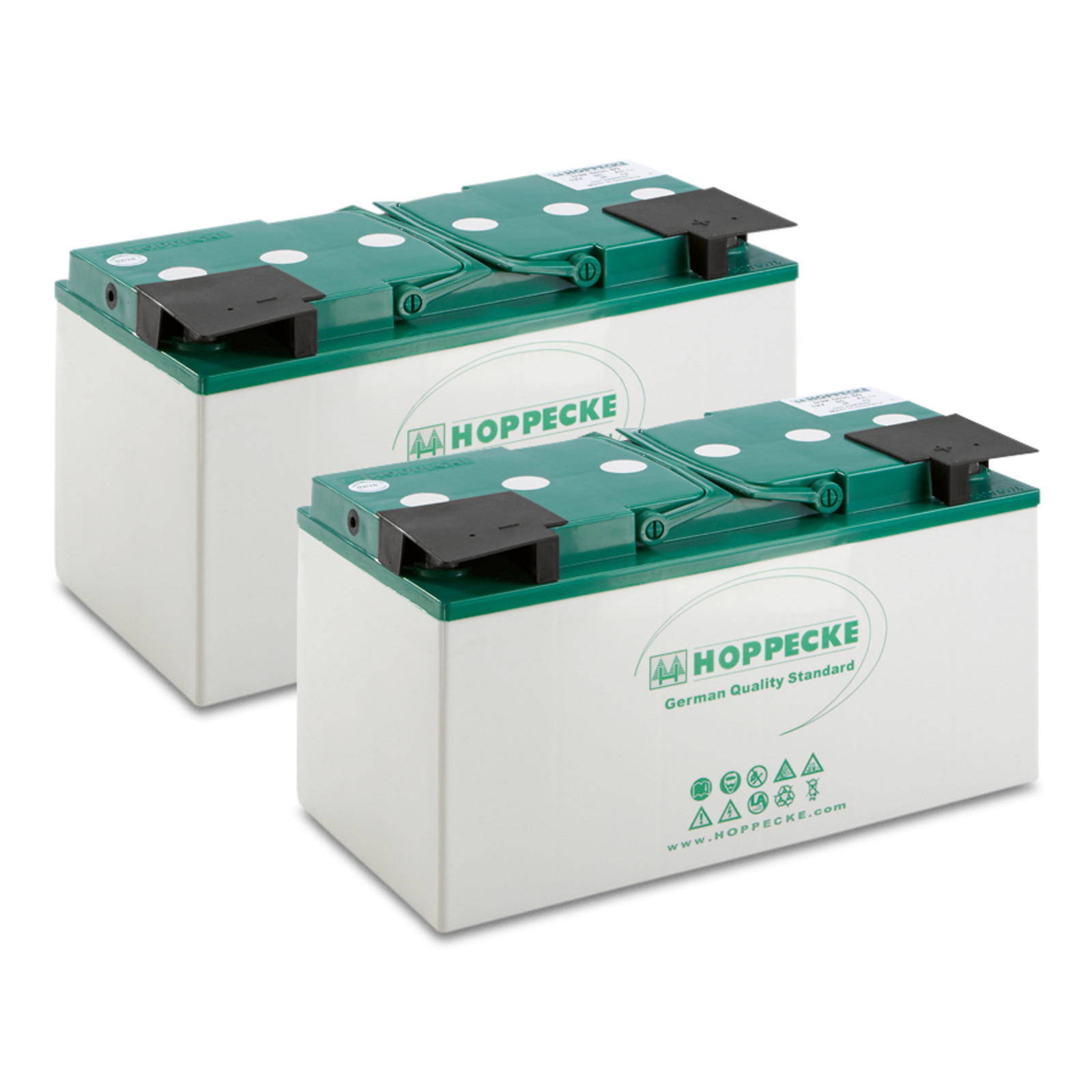 Two Hoppecke batteries with green tops and white bodies, featuring logos and safety symbols.