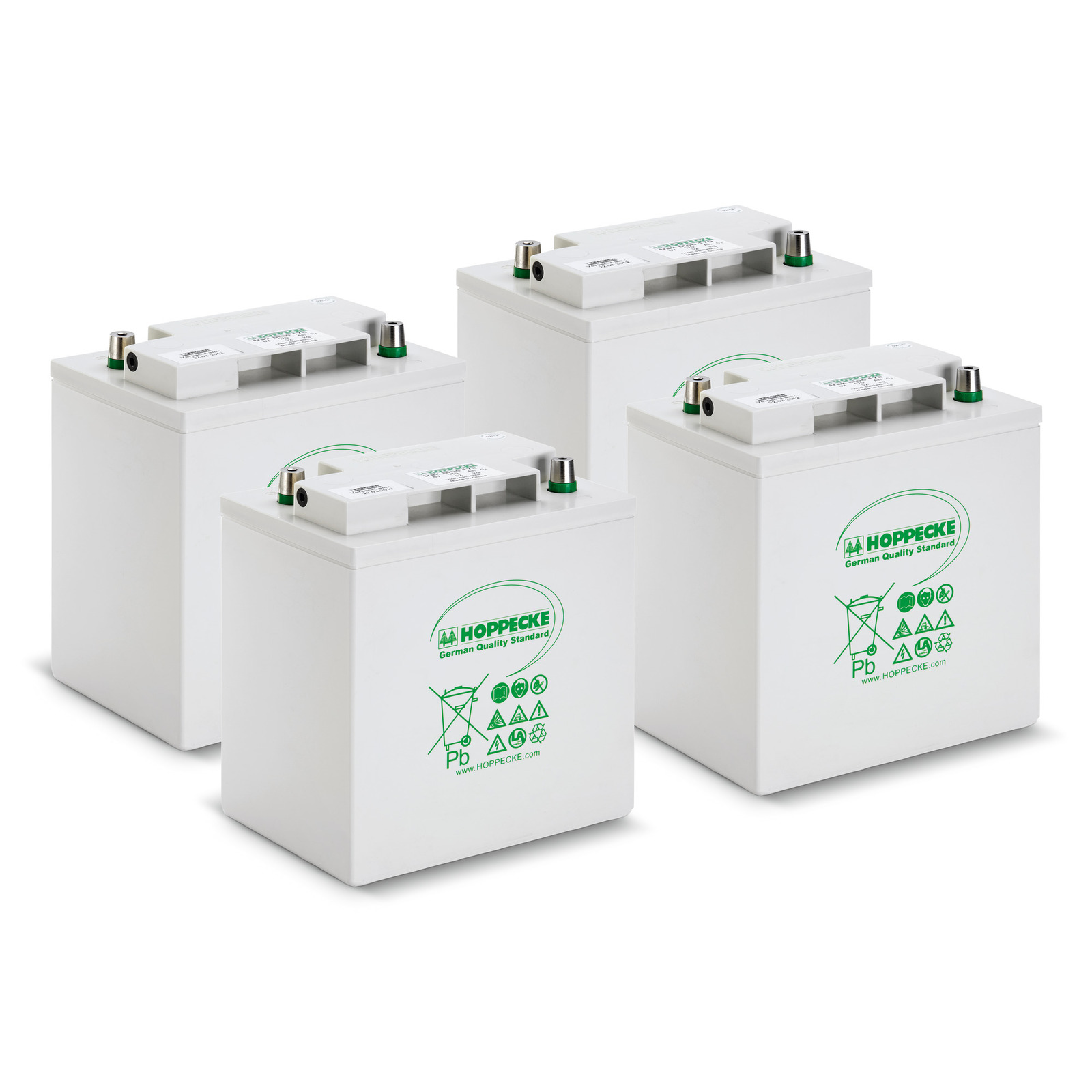 Four white Hoppecke batteries with green branding, arranged in a group on a white background. Four white Hoppecke batteries with green branding, arranged in a group on a white background.