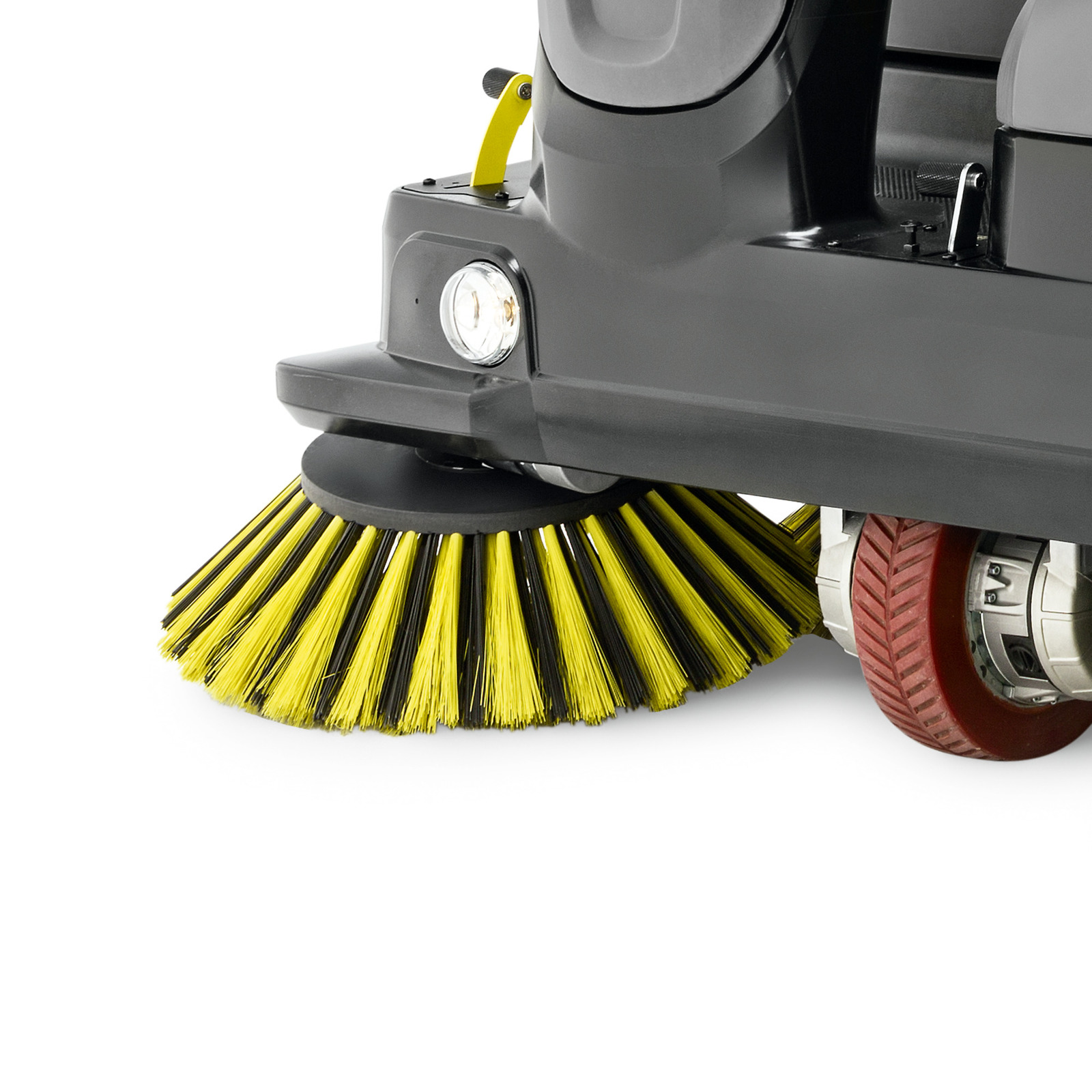 Close-up of a Kärcher sweeper's yellow brush and red wheel on a white background. Close-up of a Kärcher sweeper's yellow brush and red wheel on a white background.