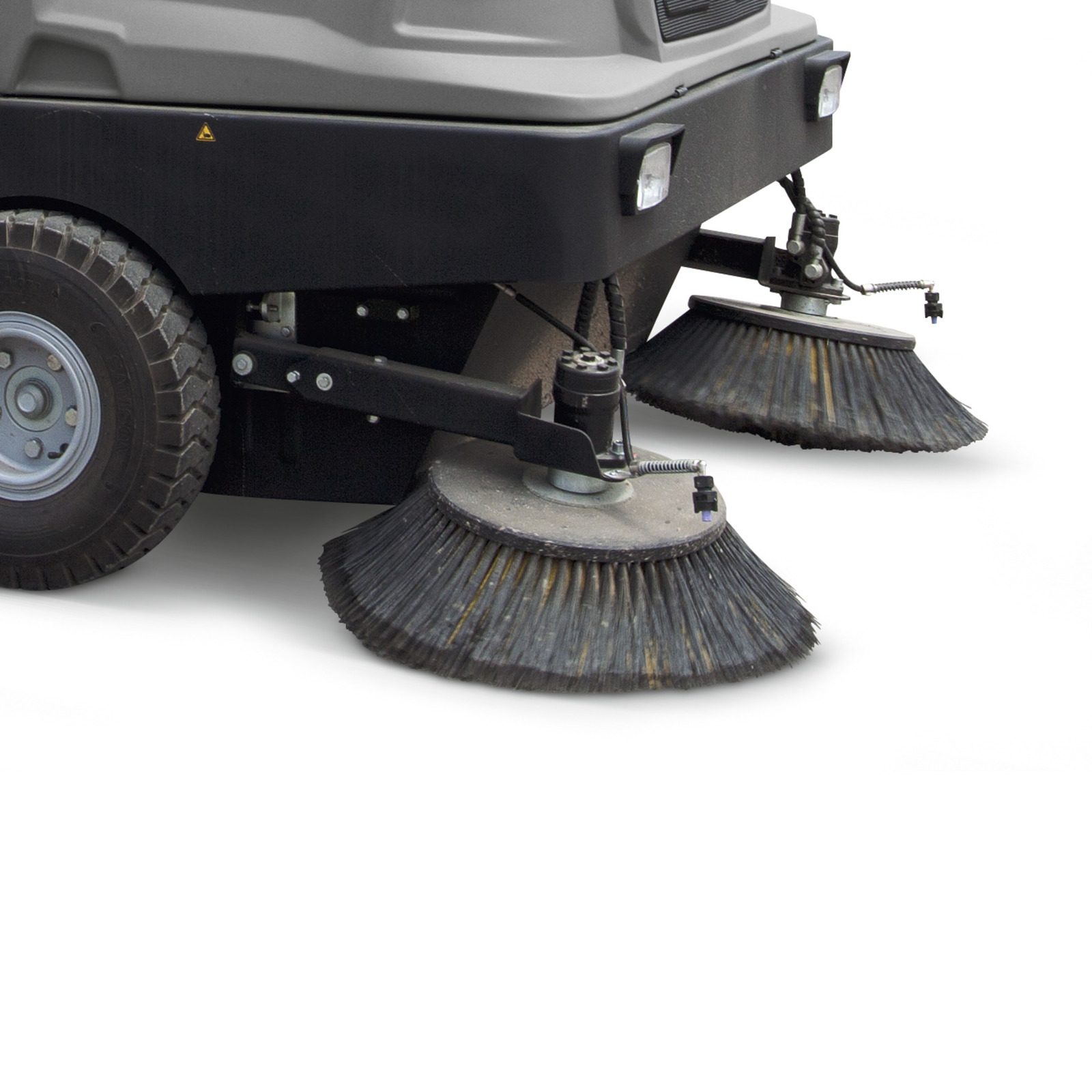 Kärcher floor sweeper with dual rotating brushes and sturdy wheels, designed for efficient cleaning.