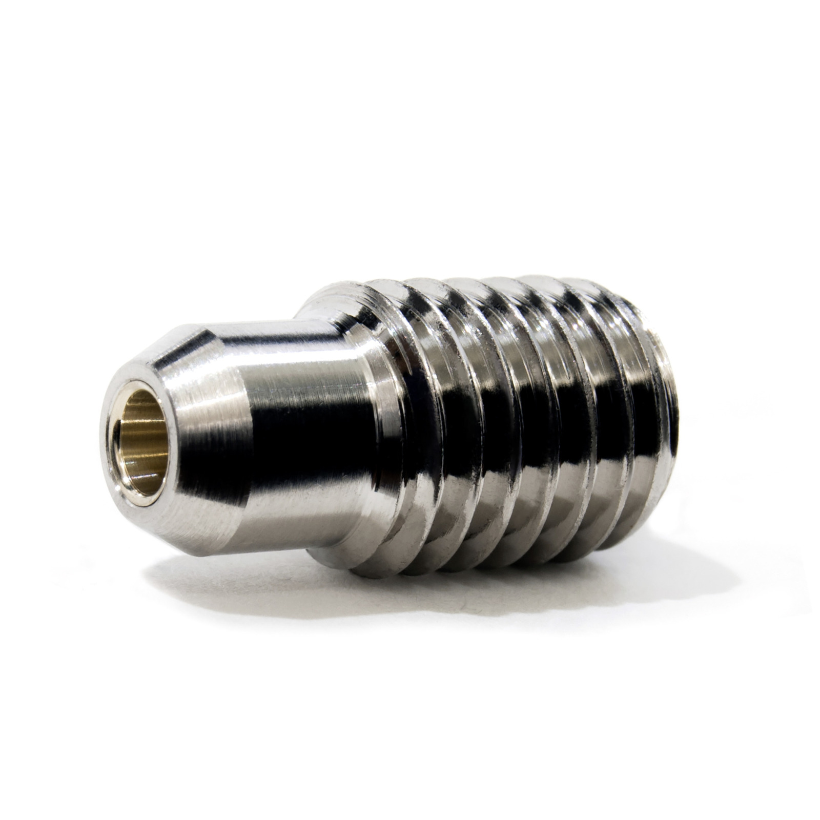 Metal nozzle with threaded body, shiny finish, lying on a white surface.