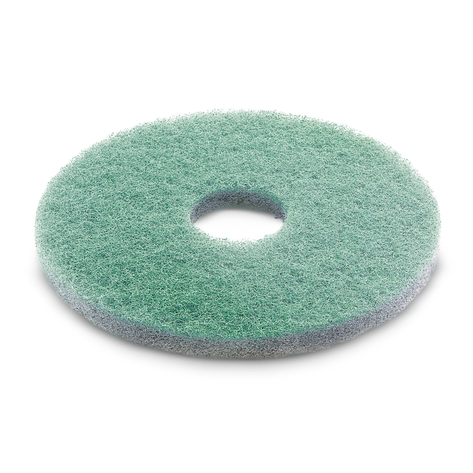 Round green scrubbing pad with a central hole, textured surface, viewed from an angle on a white background. Round green scrubbing pad with a central hole, textured surface, viewed from an angle on a white background.