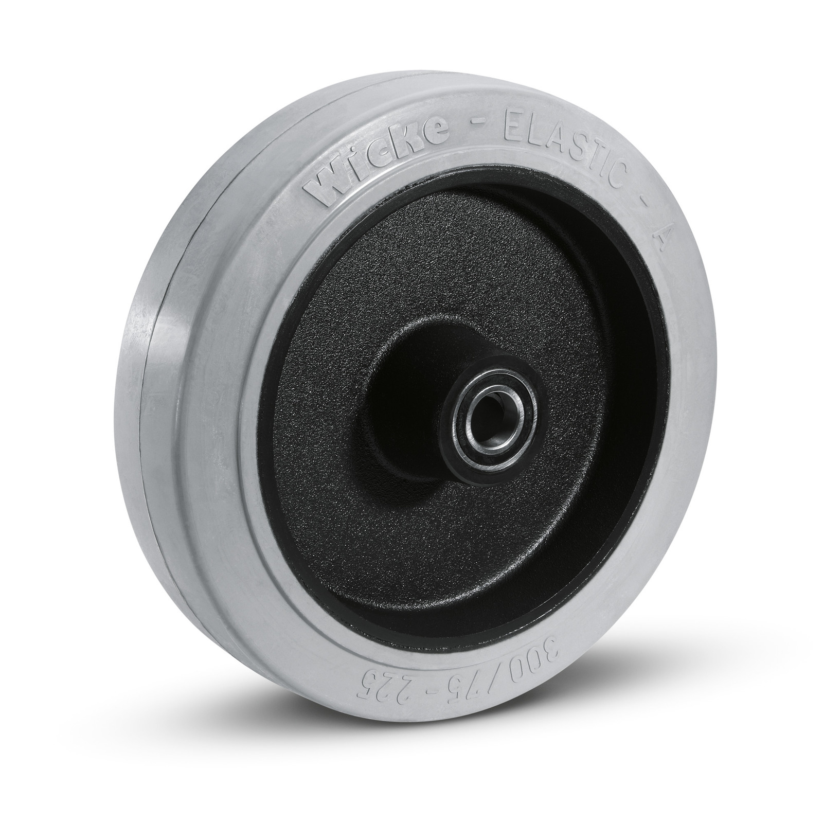 Grey rubber wheel with black hub and visible ball bearing, embossed with "Wicke - Elastic - A" on the outer rim.