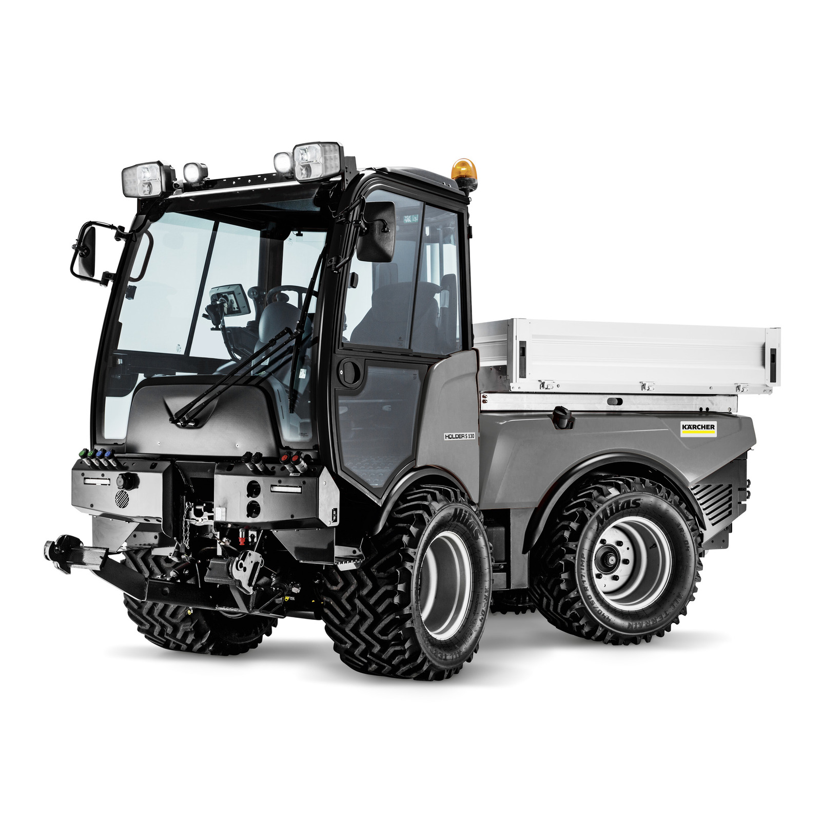 Kärcher utility vehicle with enclosed cab and rear cargo bed, featuring large tyres and front attachments.