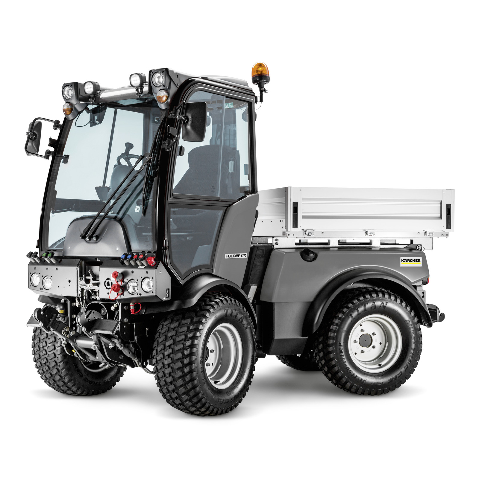 Kärcher utility vehicle with enclosed cab, large tyres, and rear cargo bed, featuring multiple headlights and an orange beacon.